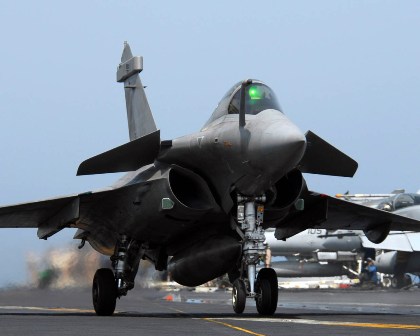 Pictured: A French Navy Rafale strike jet cross-decks on a US Navy carrier in the Arabian Sea. Photo: US Navy.